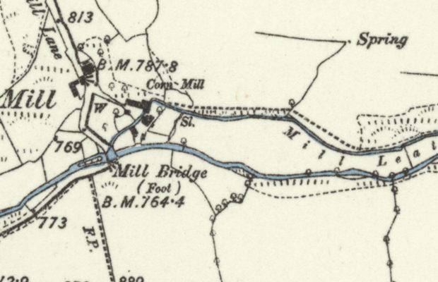 Six-inch first edition in west Somerset: a corn mill with a weir and sluice, and a channel lettered Mill Leat leaving the river above the mill and running parallel to it.